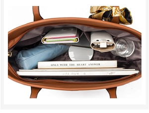 Top view of the interior of a brown tote bag with printed scarf showing large capacity space
