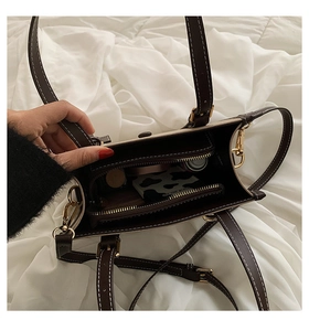Detail of spacious interior layout with zipper pocket and white contrast stitching