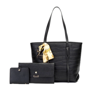 Detail view of black crocodile pattern 3-piece bag set with printed silk scarf