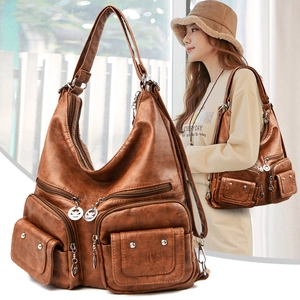 Brown vintage multi-pocket faux leather handbag with silver hardware and shoulder strap