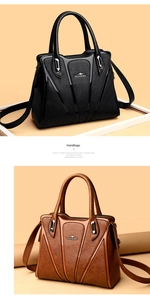 Detail of elegant black and brown handbags featuring metallic kangaroo logo and matte finish