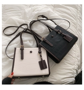 Crocodile pattern tote bags in black and ivory white with gold hardware and shoulder straps