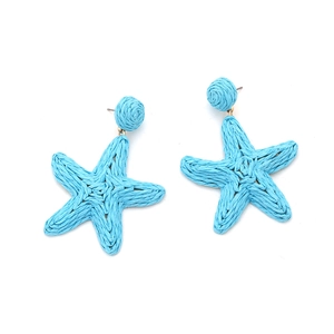 Macro detail of sky blue woven raffia starfish earrings with handcrafted straw texture