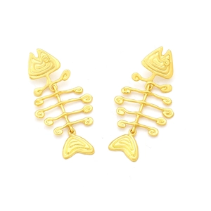 Detailed view of the three-section golden fishbone earrings with textured metal surface