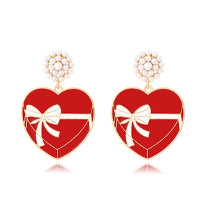 Elegant red heart drop earrings with white bow pattern and pearl cluster studs