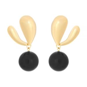 Detail of gold curved metal earrings with hanging polished black spherical pendants