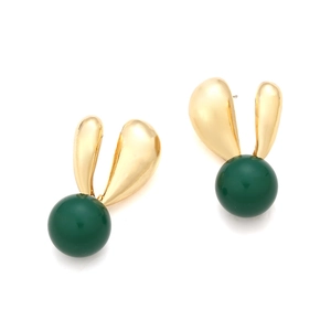 Detailed shot of golden rabbit-ear earrings with dark green resin sphere pendants