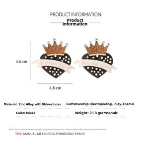 Detail view of heart-shaped earrings with Birthday Queen text and size measurements