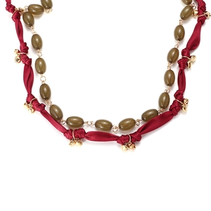 Double-layer necklace with green resin beads and red satin ribbon featuring gold bells