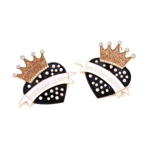 Vintage heart earrings with black enamel, golden crown, and Birthday Queen text