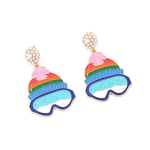 Colorful winter ski hat earrings with faux pearls and goggles pendant on white background