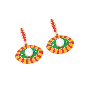 Detail view of exotic evil eye drop earrings with vibrant enamel and central white pearl