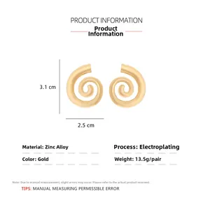 Detail view of gold conch earrings with size specs 3.1cm height and 2.5cm width