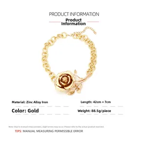 Macro detail of golden rose flower pendant showing 3D petal texture and thick metal chain