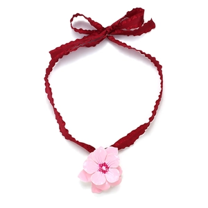 Pink enamel flower pendant choker featuring a red ruffled lace ribbon with a bowknot