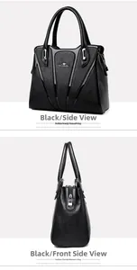Detail view of black lychee grain faux leather handbag with silver kangaroo logo plaque