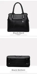 Detail view of the black leather handbag featuring back zipper pocket and bottom metal studs