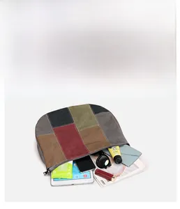 Large canvas tote bag interior showing capacity with tablet, wallet, and sunglasses