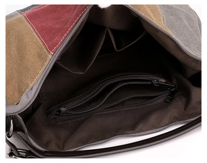 Detailed interior of a canvas bag showing large capacity, zipper pockets, and lining