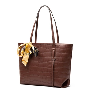 Brown crocodile embossed tote bag with floral silk scarf and long shoulder straps