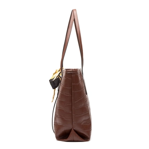 Brown crocodile embossed tote bag with decorative silk scarf and side profile view