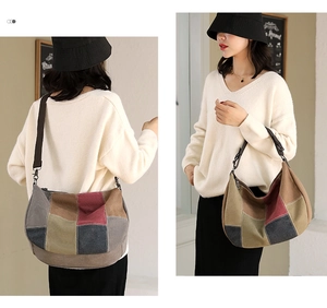 Detail of color-block canvas bag showing multi-colored panels and wide shoulder strap