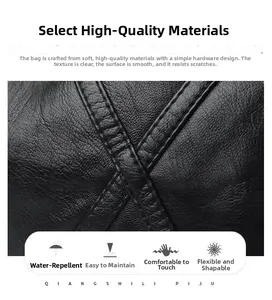 Detailed macro view of soft litchi grain leather and waterproof hardware of the bag