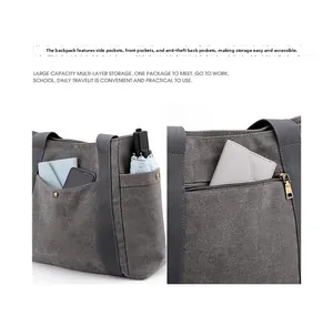 Dettaglio borsa in tela grigio scuro con tasche multiple e zip antifurto posteriore