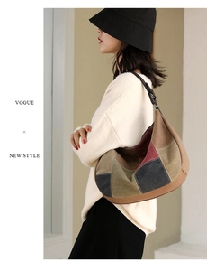 Detail of a large color-block canvas hobo bag with vintage patchwork and leather strap