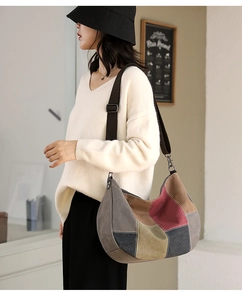 Detail view of multi-color canvas tote bag with adjustable strap and vintage stitching