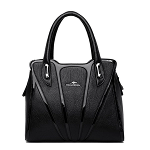 Large black leather handbag with chic V-shape patent stitching and silver hardware