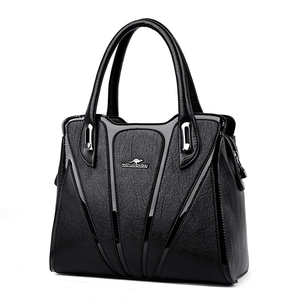 Fashionable black faux leather large tote bag with V-shaped design and top handles
