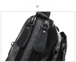 Detail of premium black lychee leather texture and smooth double zipper closure for handbags