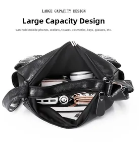 Detail view of the large capacity interior of this black lychee grain leather handbag