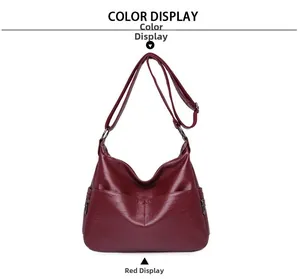 Detail view of burgundy PU leather shoulder bag featuring side metal zippers and textures