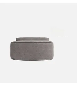 Detailed macro view of high-quality grey canvas bag texture and reinforced stitching