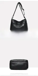 Detail view of the black PU leather crossbody bag featuring a back zip pocket and wide base