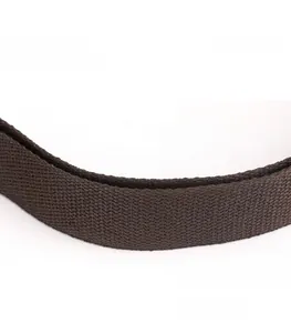 Detail shot of the comfortable wide brown woven canvas shoulder strap on the bag
