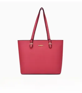 Macro detail of dark pink tote bag showing cross-grain leather texture and gold hardware