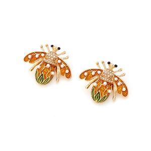Golden bumblebee earrings with orange enamel, pearls and crystals on a white background