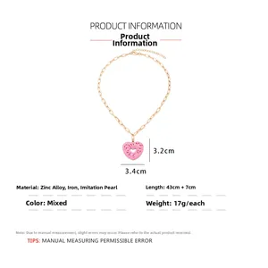 Detail showing pink enamel heart pendant dimensions and polished golden chain necklace