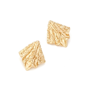 Close-up of golden geometric earrings with liquid-style wrinkled metal texture