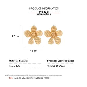 Detailed view of large gold flower earrings with dimensions 4.7x4.5cm and zinc alloy texture