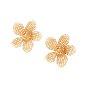 Macro view of golden five-petal flower earrings with textured petals and matte finish