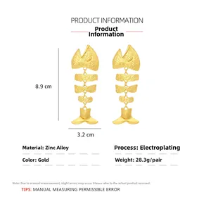 Detailed view of large gold fishbone earrings with 8.9cm length and weight specifications