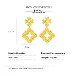 Detail of gold geometric woven earrings with dimensions and material specifications