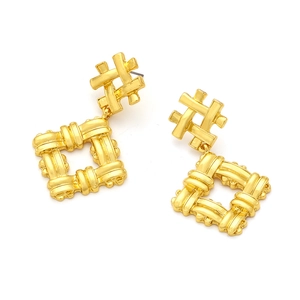 Detail of vintage geometric woven pattern alloy drop earrings in a gold-plated finish