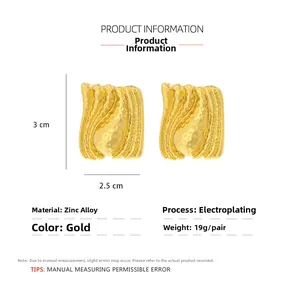 Detailed view of irregular pleated gold zinc alloy earrings with wave texture and plating