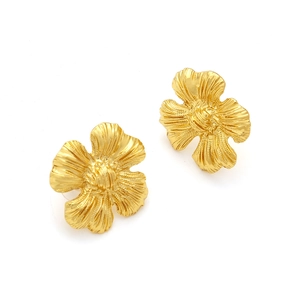 Retro golden four-petal flower earrings with textured radiating relief on white background