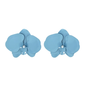 Close-up of matte sky blue orchid earrings with central white pearl accents on metal